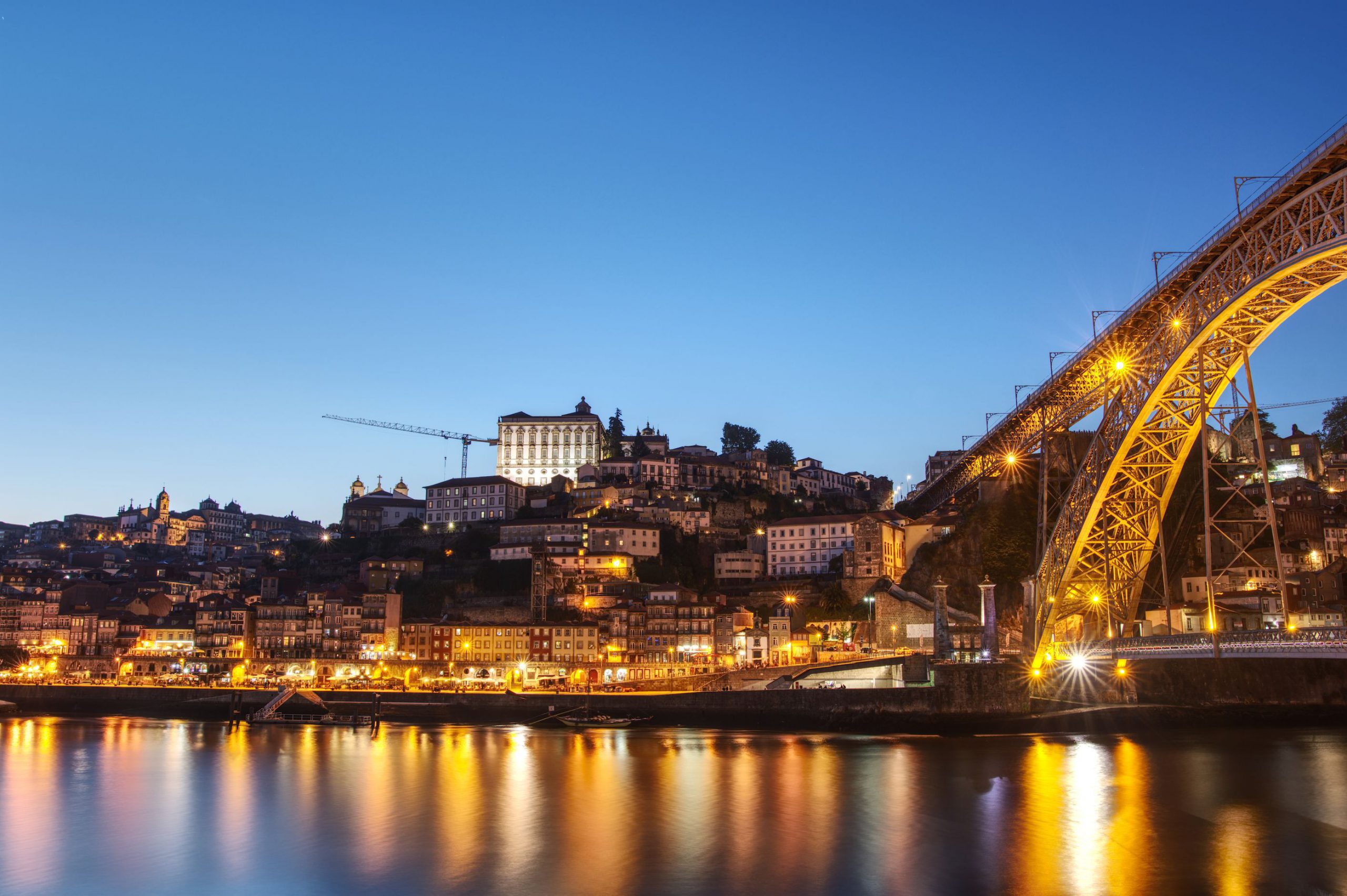 View of Porto and the bridge "Ponte Luíz I" at the beginning of the blue hour