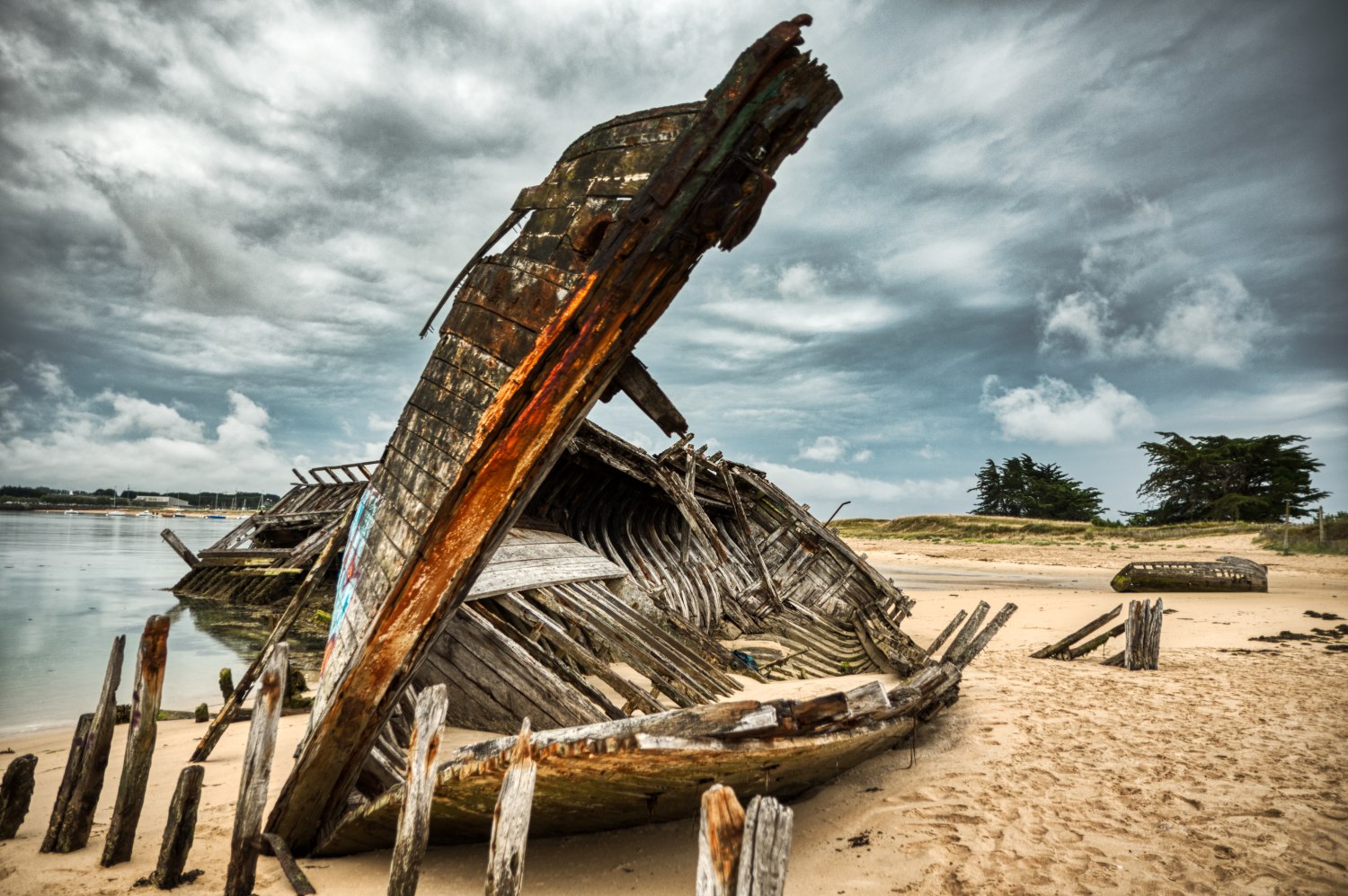 The skeleton of an old fishing boat at the ship graveyard of Étel
