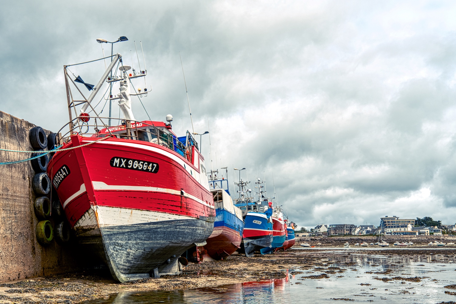 Fishing boats are waiting for the tide in the port of Roscoff