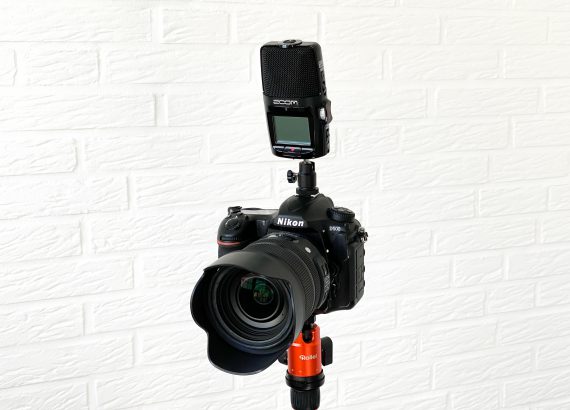 Connect Zoom H2n audio recorder to DSLR camera and use as microphone.