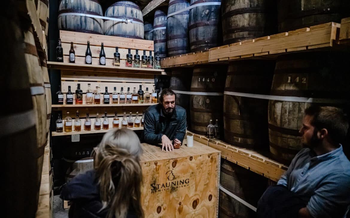 Between the stocked barrels, by far the coolest bar I've ever seen.